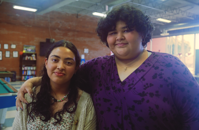 WeThrive students Cisa Salazer  and Chelsea Vasquez smile and embrace at the Hawthorne Teen Center in Hawthorne, California.