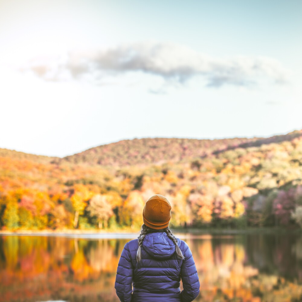 Woman at lake in autumn