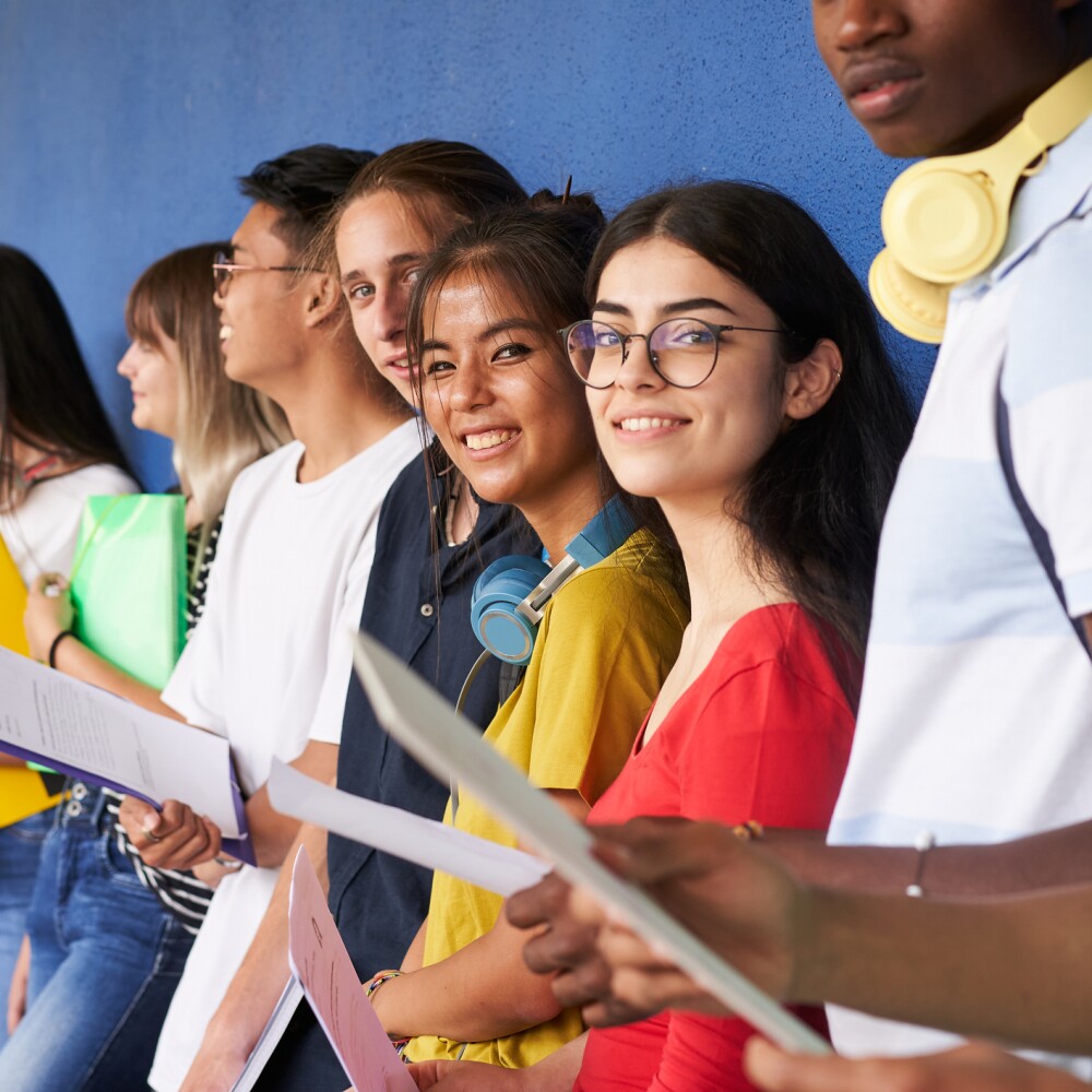 Students Holding Papers