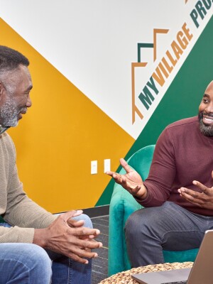 Ronnie King holds a conversation at My Village Project offices.