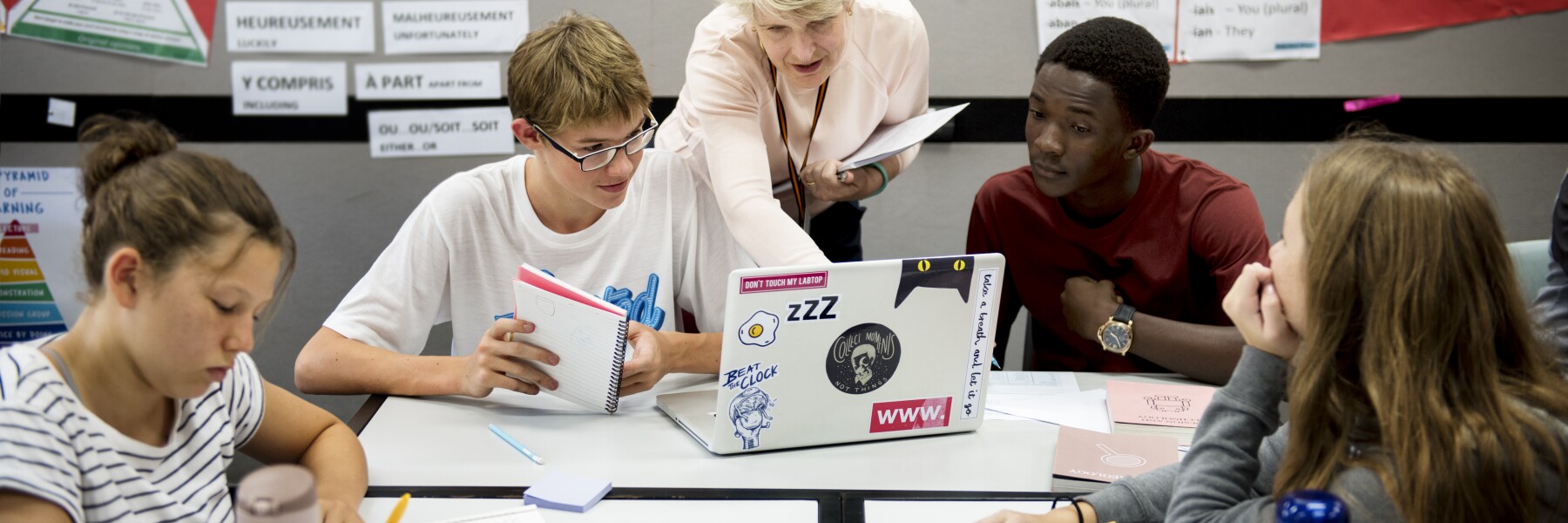 Group of students learning in classroom