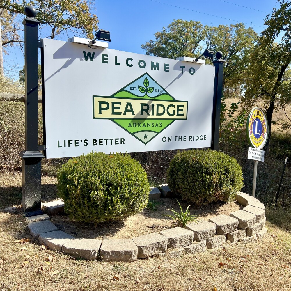 A large sign shows a new logo for the city of Pea Ridge, Arkansas