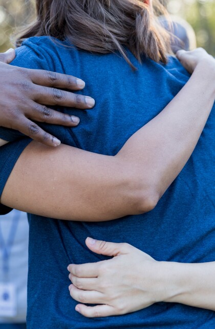 Friends Arms Around Each Other