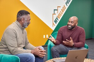 Ronnie King holds a conversation at My Village Project offices.