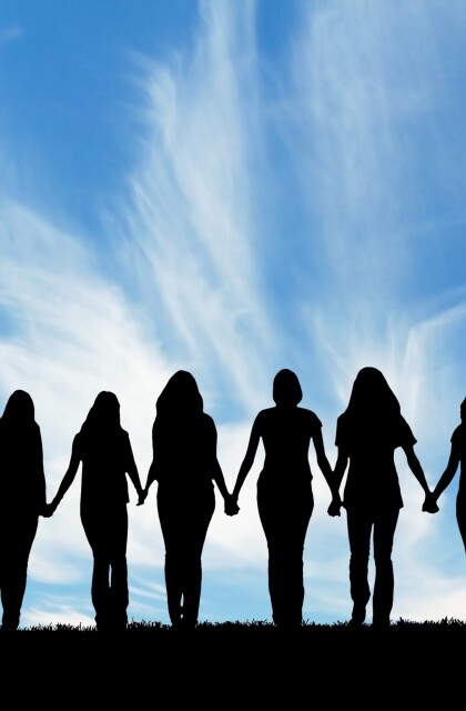 Women holding hands stock photo