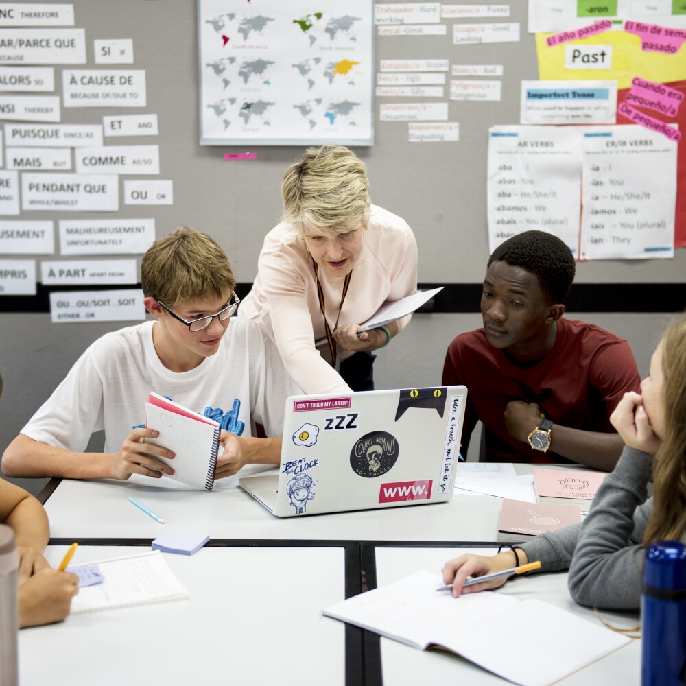 Group of students learning in classroom