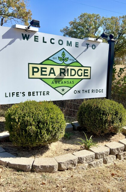A large sign shows a new logo for the city of Pea Ridge, Arkansas