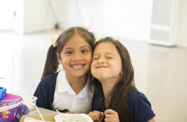 Two students smiling TLC Innovative Schools