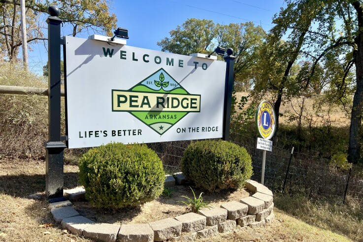 A large sign shows a new logo for the city of Pea Ridge, Arkansas