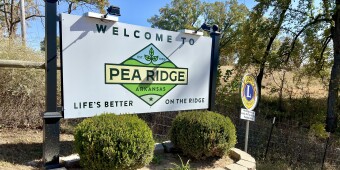 A large sign shows a new logo for the city of Pea Ridge, Arkansas