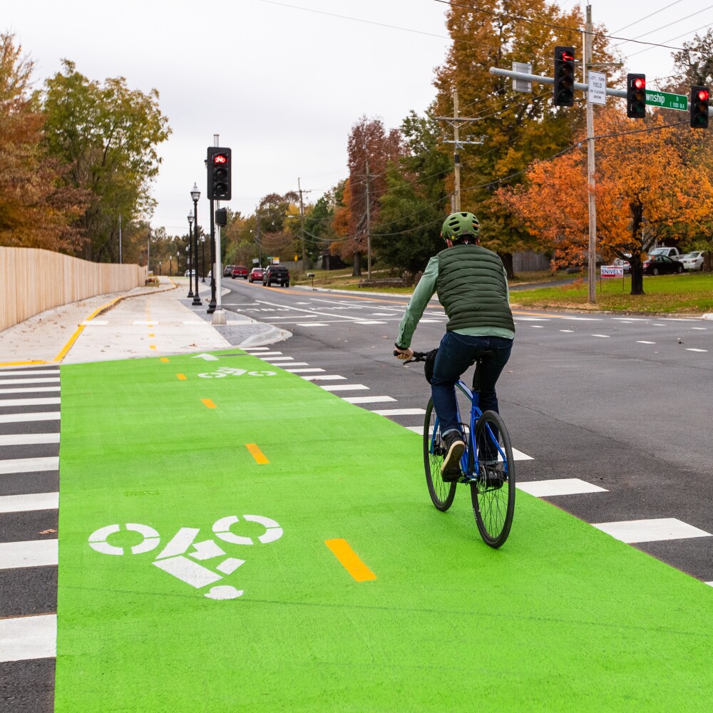 Jeremy Pate rides a bike on the greenway