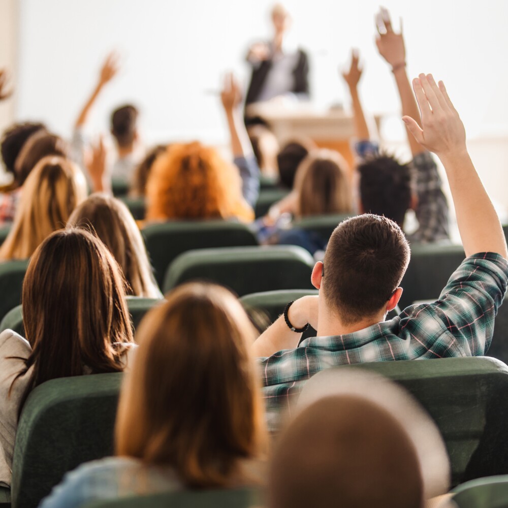Students Hands Raised stock