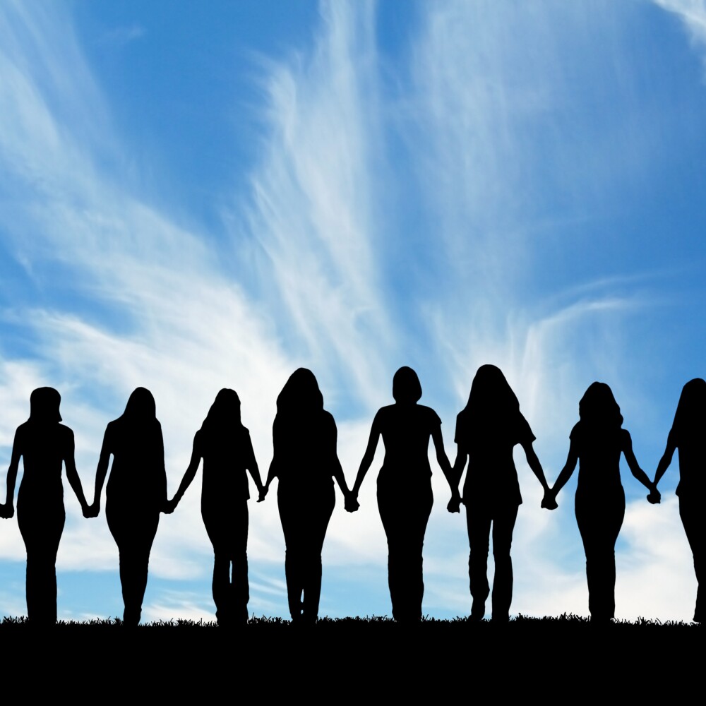 Women holding hands stock photo