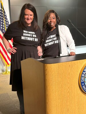 Anashay Wright stands at a podium at the U.S. Department of Education. 