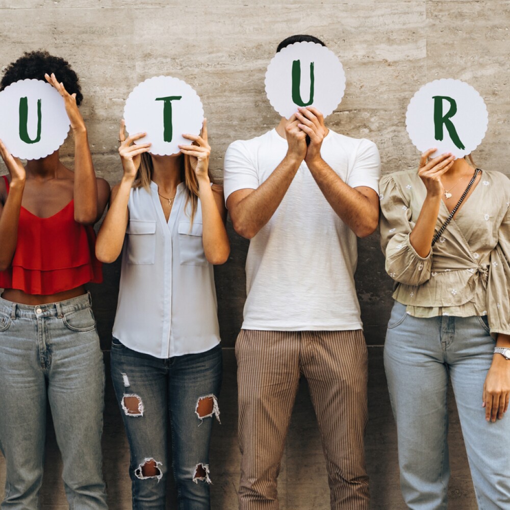 Group of young people hiding their face with the world Future.