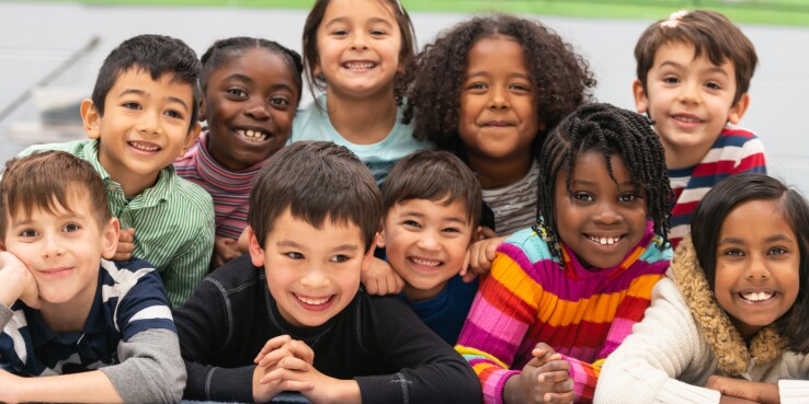 Diverse elementary students smiling