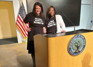 Anashay Wright stands at a podium at the U.S. Department of Education. 